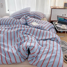 Simple Red and Blue Striped Duvet Cover and Four Piece Bed Sheet Set with Washed Cotton Bedding on the Bed